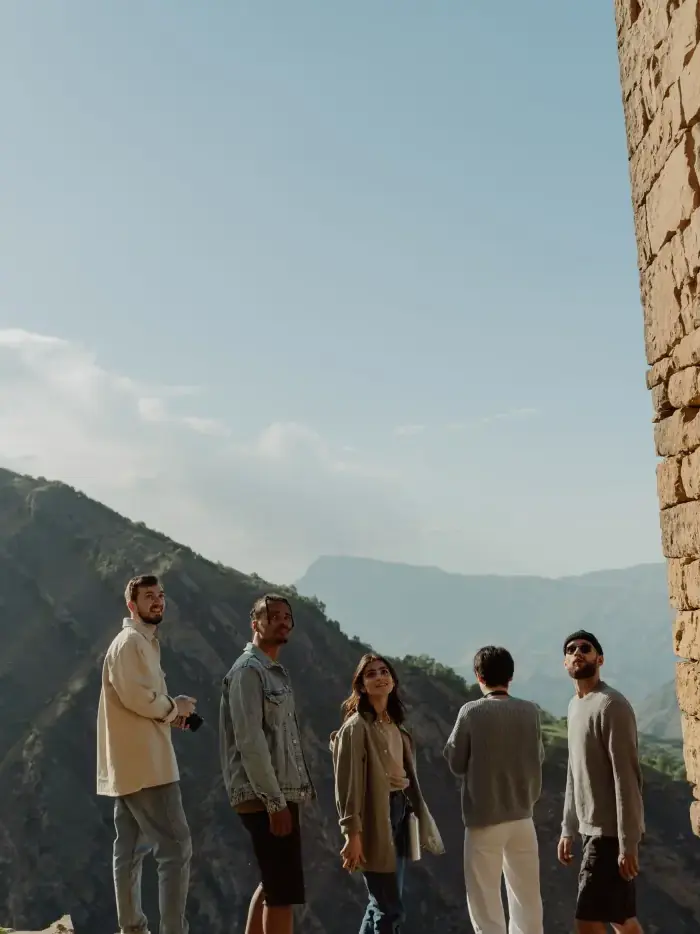 Walkers on a ridge between stone walls